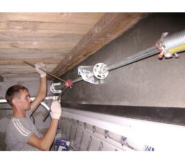 Регулировка торсионного механизма секционных ворот, фото 1